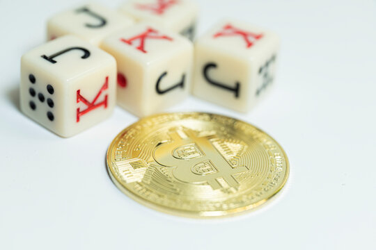 Golden digital currency coin with game dice around The Concept of digital wealth and luck