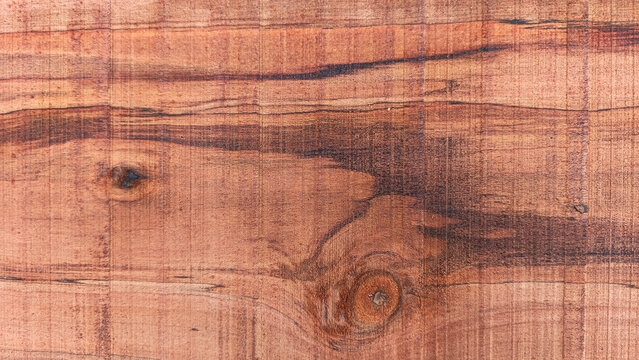 Exotic dark brown wood texture with tiger stripes and knots