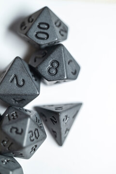 Black polyhedral dice for roleplaying games The Concept of fantasy adventure