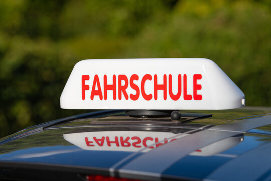 Driving school roof sign in german language, legal required to alert road users that a student driver is behind the wheel, car driver license concept