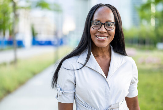 Portrait of a happy businesswoman smiling in the city
