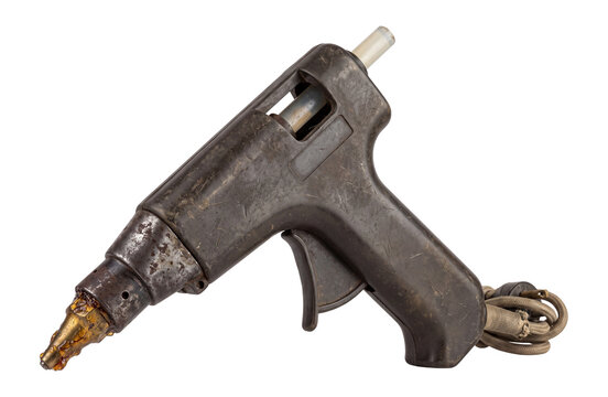 Vintage glue gun, aged metal and plastic tool with worn texture isolated on transparent background