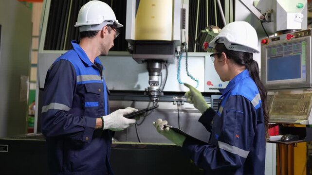 Industrial team inspecting machinery, Factory worker and supervisor discussing machine operation in manufacturing plant, Engineers checking control panel and equipment in factory workshop