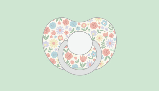 Cute baby pacifier with a colorful pastel floral pattern on the guard isolated on a soft mint green background.