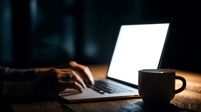 Person Typing on Laptop at Night with Coffee Mug &ndash; Focused Late Night Work and Study Concept