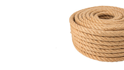 A neat coil of thick natural brown jute rope isolated on transparent background. © JackWatson