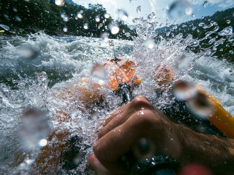 POV of Paddler Navigating Whitewater River Rapids