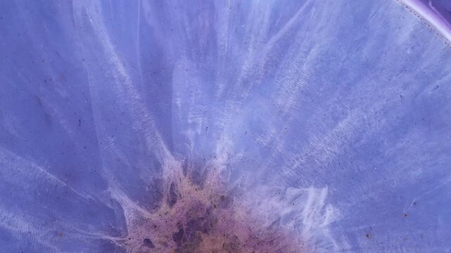 Mixing alcohol ink and epoxy resin in different colors close-up view