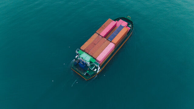 Aerial view from a container drone. Container ships in export-import and logistics business Transporting goods to large ports Worldwide shipping and logistics business International business abroad