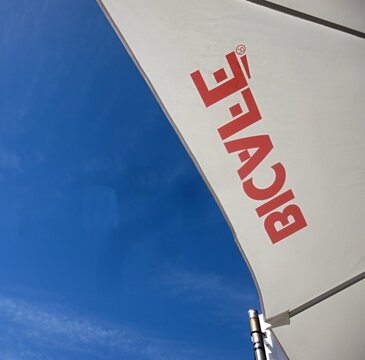 Bicaj caf&eacute; umbrella shading from the sun against blue sky