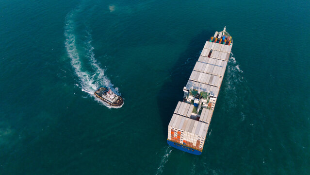 Aerial view from a container drone. Container ships in export-import and logistics business Transporting goods to large ports Worldwide shipping and logistics business International business abroad