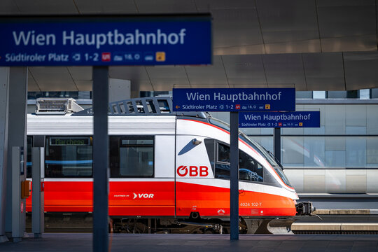 Vienna, Austria - August 14, 2026: Trains at the platform of a modern railway station.