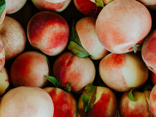 Fresh Ripe Peaches with Green Leaves © senteliaolga
