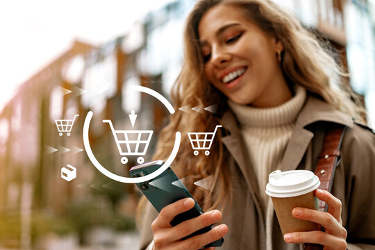 Online shopping during daytime with a woman using a smartphone in an outdoor setting