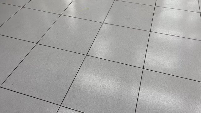 Wide angle perspective of clean ceramic floor tiles pattern