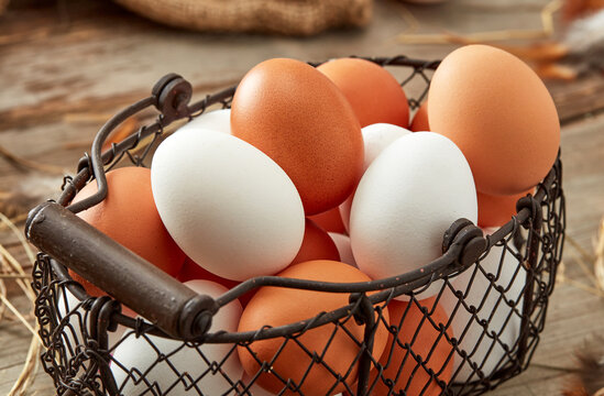 fresh eggs in rustic basket