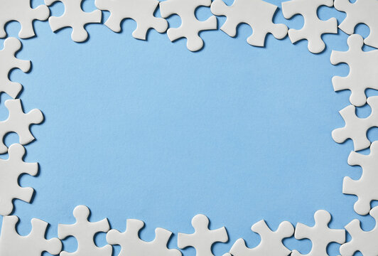 Puzzle border on blue background