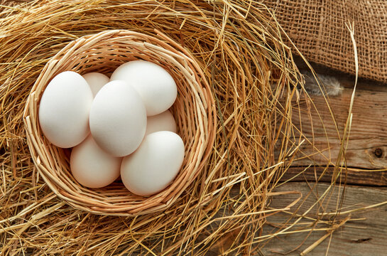 white eggs in rustic nest