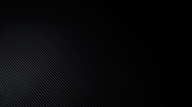 Dark diagonal textured surface with subtle light gradient and repeating ridges