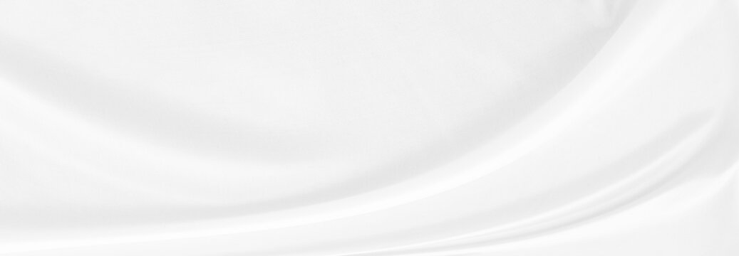 White gray satin texture that is white silver fabric silk background with beautiful soft blur pattern natural.