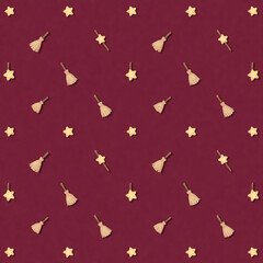 Fototapeta premium Halloween pattern with tiny brooms and stars on burgundy