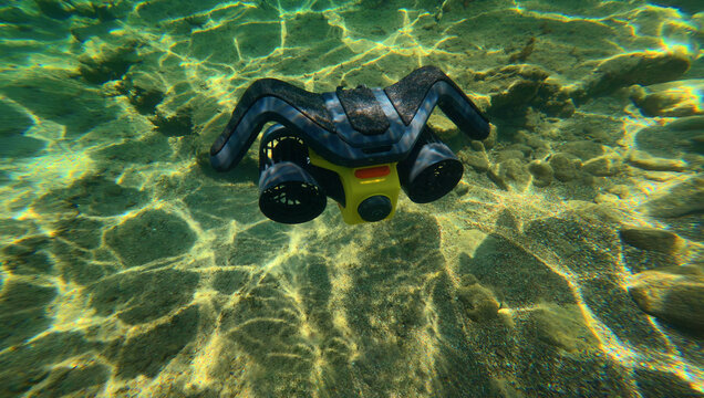 Underwater photo of latest technology water scooter used for scuba diving and snorkeling  featuring motor propulsion