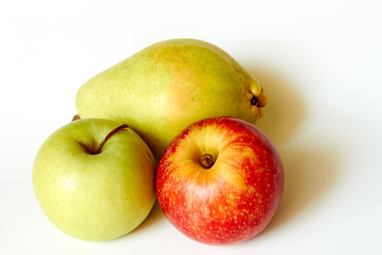 Green apple red apple and pear isolated on white background