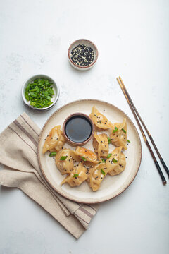 Gyoza dumplings soy sauce chopsticks asian Japanese food wontons