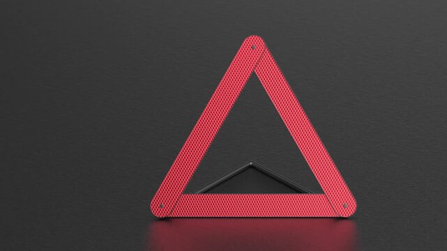 Emergency warning triangle on asphalt road