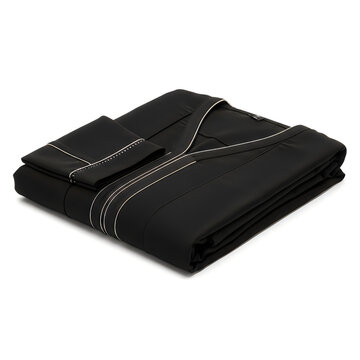 Folded black bed sheet set with white stitching isolated on a plain white background