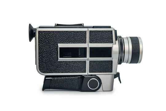 Retro film camera on white background with copy space. Side view, minimalism. Vintage technology.