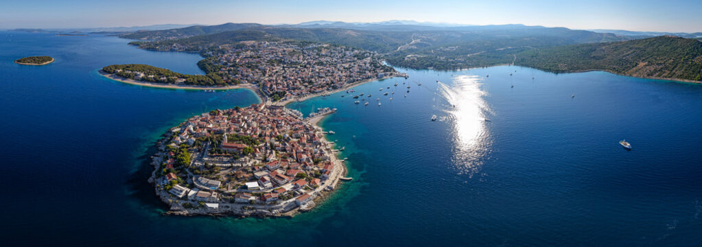Ultra wide aerial panoramic view of Primosten old town peninsula, turquoise bays and Dalmatian coastline in Croatia
