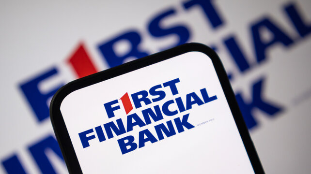 First Financial Bank logo on smartphone screen for retail banking and personal finance services.