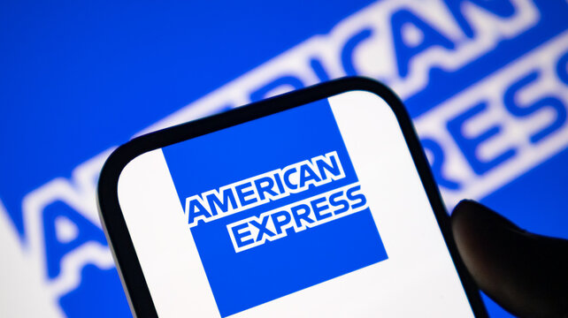 American Express card logo on mobile device with blue branding background.