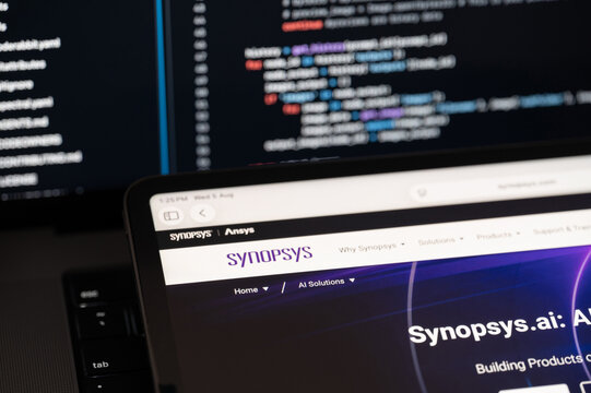 Synopsys Ai company web page on program code background
