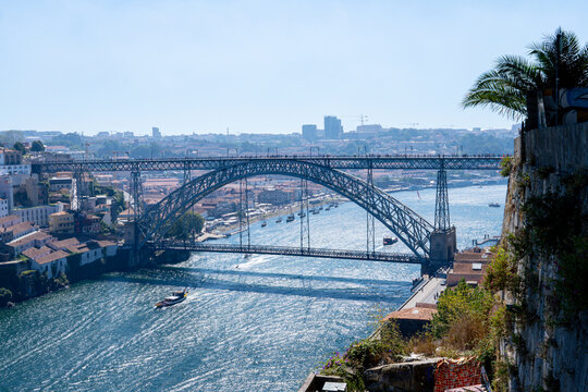 Horizontal high angle panoramic view of Dom Luis bridge over douro river in Porto (Portugal)