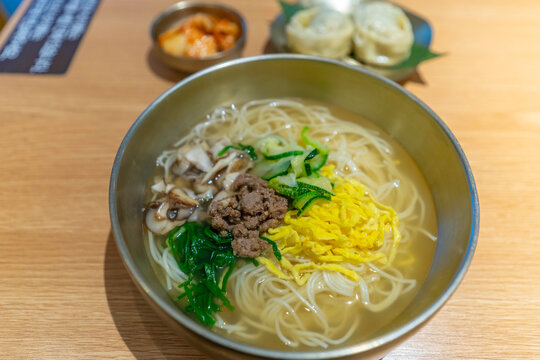 View of traditional South Korean noodle dish on Suwon Rodeo Street at night, Suwon, Gyeonggi Province, South Korea