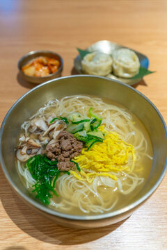 View of traditional South Korean noodle dish on Suwon Rodeo Street at night, Suwon, Gyeonggi Province, South Korea