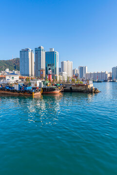 View of city skyline and bay from near Jagalchi Market on a sunny day, Jung-gu, Bupyeong-dong, Busan, South Korea