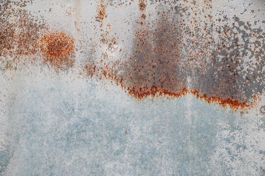 Distressed Light Blue and White Iron Wall Texture with Rust Stains.