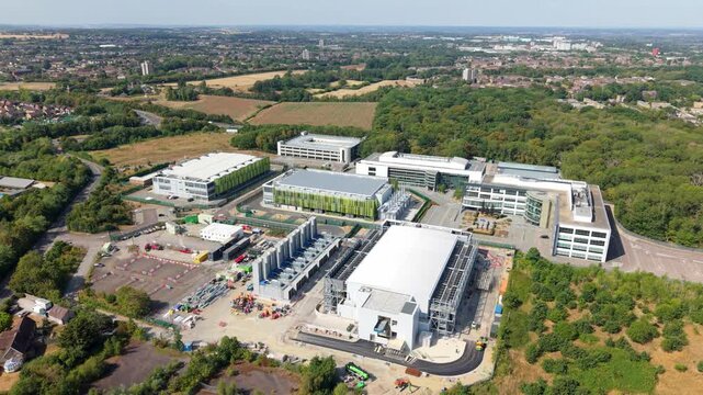 Hyperscale data center campus with server halls and backup generators in an aerial view, UK