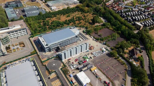 Hyperscale data center campus with server halls and backup generators in an aerial view, UK