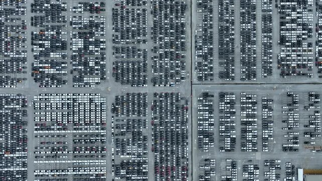 This EV car awaits shipping. Each EV car gets loaded. The EV car goes overseas.