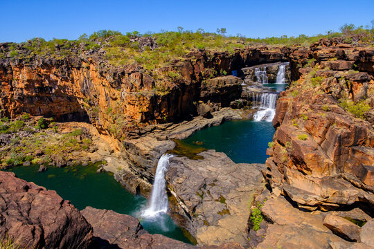 Explore Mitchell Falls with three distinct tiers and flowing water on the stunning Kimberley landscape in Australia&acirc;&euro;&trade;s outback