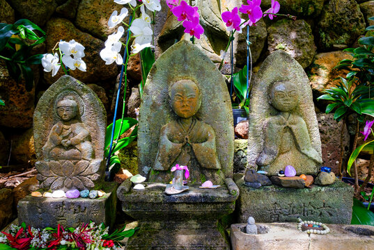 Deity statues line the pilgrimage path with hand-carved shrines at Lawai International Center in Kauai Island Hawaii