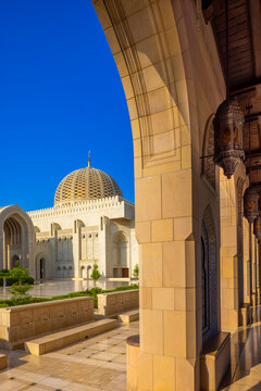 View of architectural details and dome from the walkway of the mosque in daylight in the Middle East