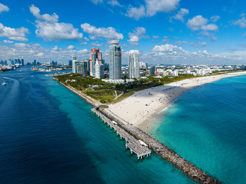 Aerial view of South Beach point with buildings, beach, water, and boats in Miami, Florida