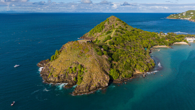 Exploring Fort Rodney on a hillside above the ocean water at Pigeon Island in Saint Lucia