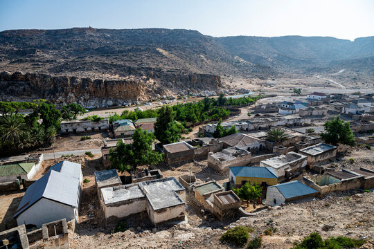View across Eyl with houses, trees, and hills from the Castle of Eyl in Somaliland during daylight hours