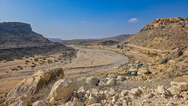 River Nugaal curves through a canyon with rocky terrain and sparse vegetation in Eyl, Puntland, Somalia
